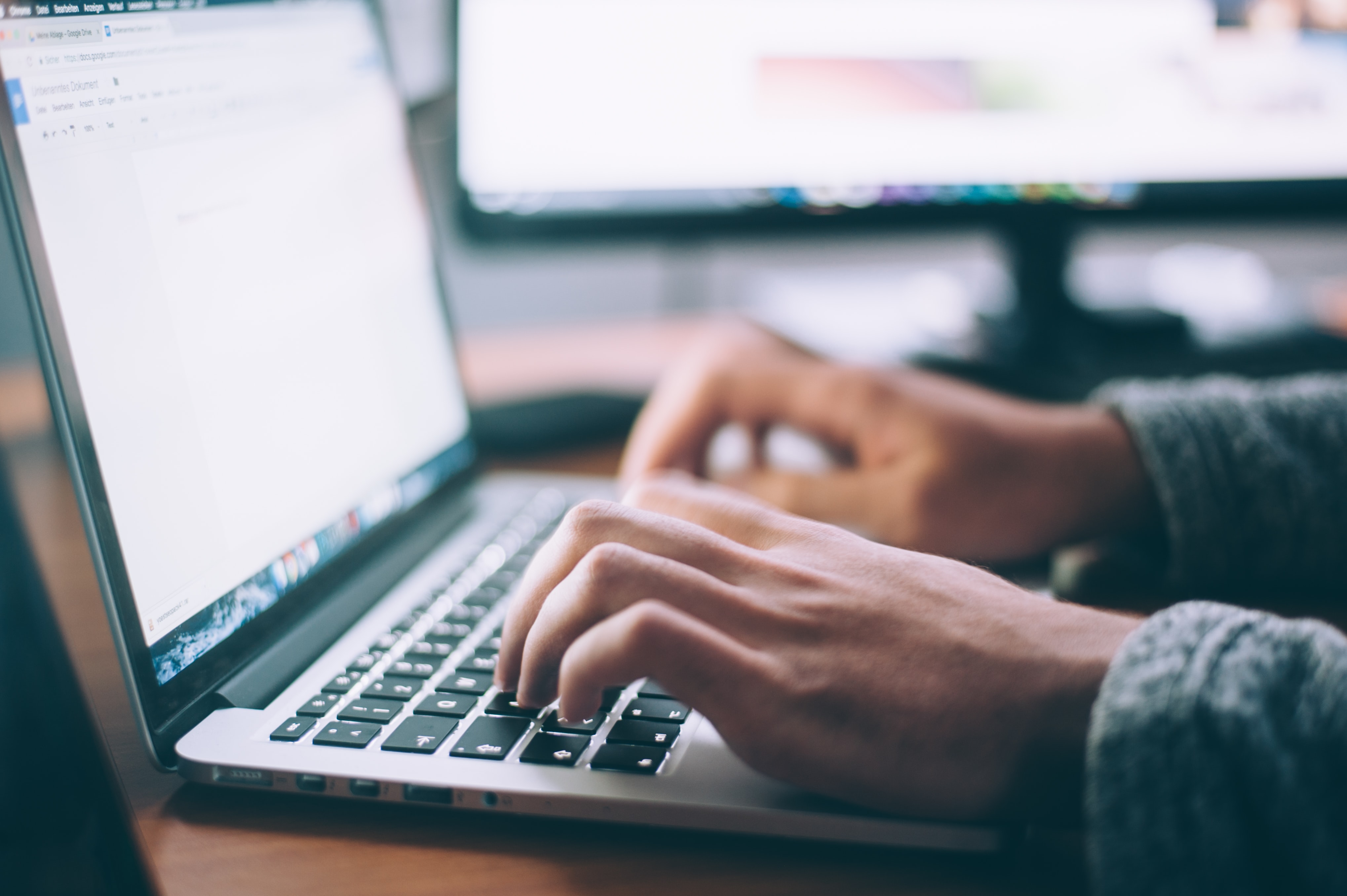 Man writing on laptop